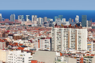 High angle view of buildings against sky in city