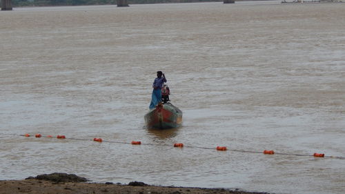 People on boat in sea