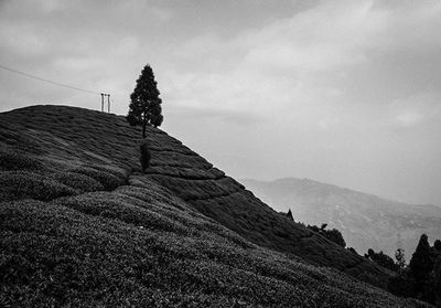 Scenic view of mountains against cloudy sky