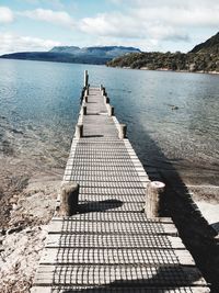 High angle view of jetty on sea against sky