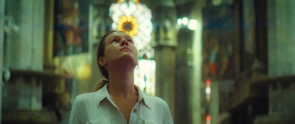 Woman enjoying view of architecture in the cathedral church. girl looking up at antique ceiling.