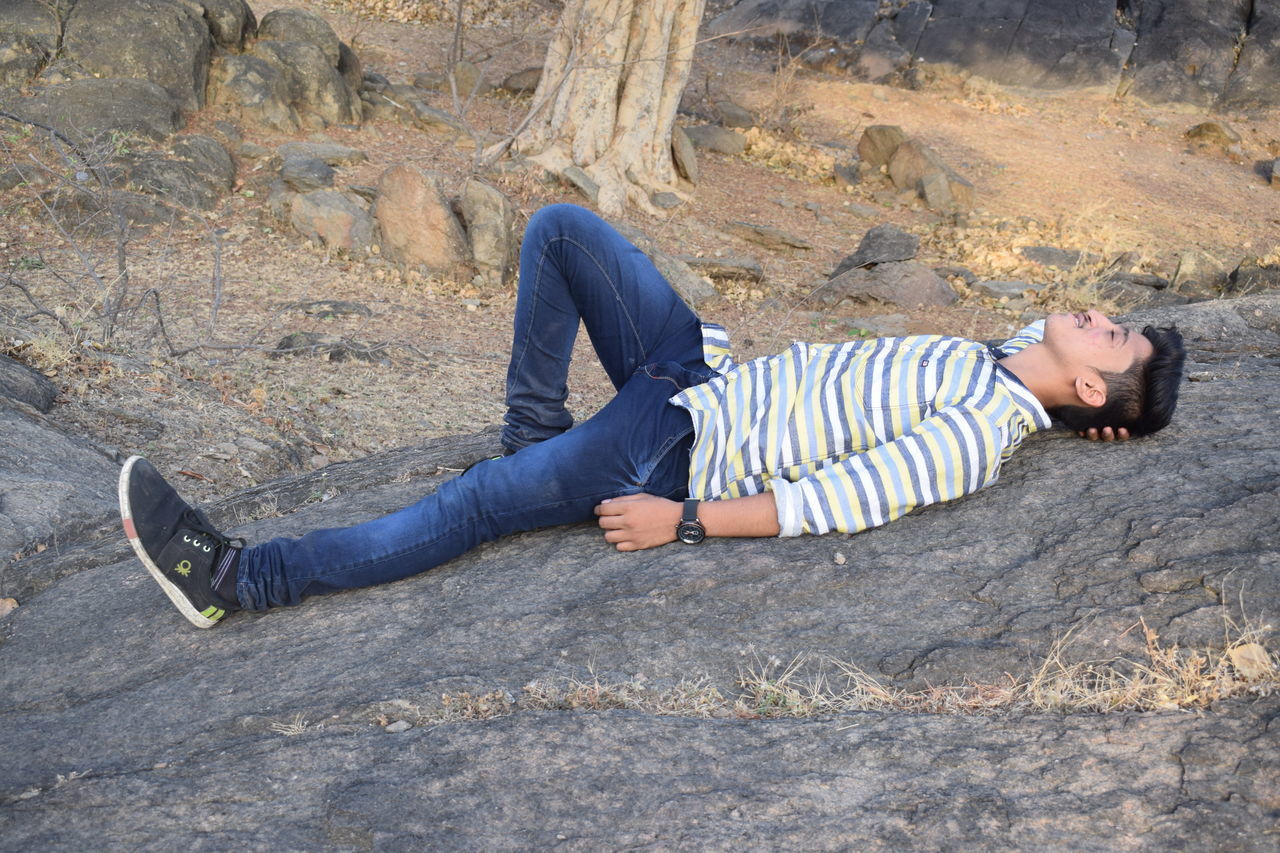 HIGH ANGLE VIEW OF WOMAN LYING DOWN ON FLOOR