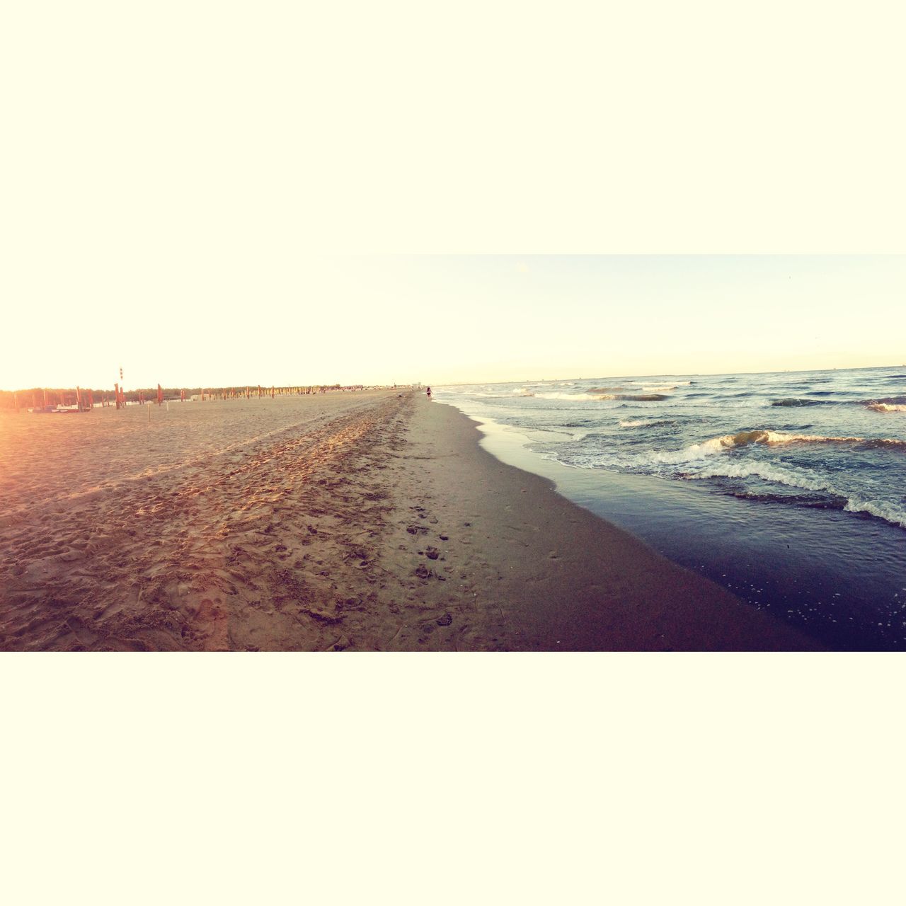 beach, clear sky, copy space, sea, horizon over water, sand, tranquil scene, tranquility, scenics, beauty in nature, water, nature, shore, the way forward, sunlight, idyllic, sky, diminishing perspective, outdoors, remote