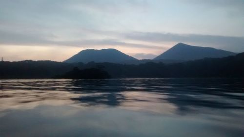 Scenic view of lake against sky during sunset