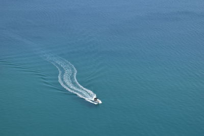 High angle view of sea against blue sky