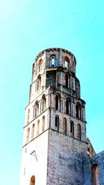 Low angle view of old building against clear blue sky