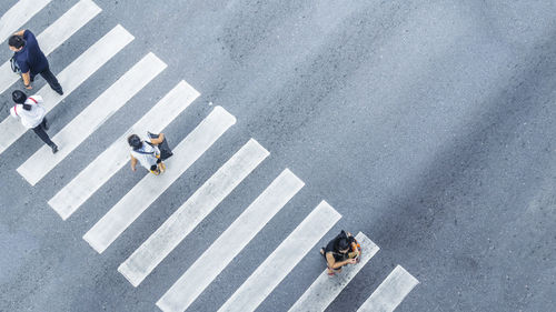 High angle view of people crossing road