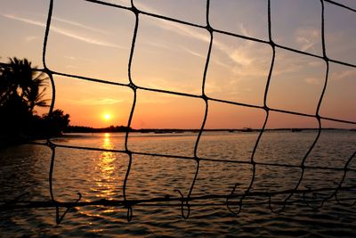 Scenic view of sea against orange sky