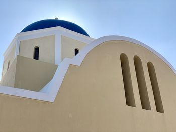 Low angle view of white building against clear sky