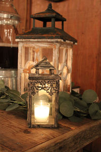 Close-up of illuminated lantern on table