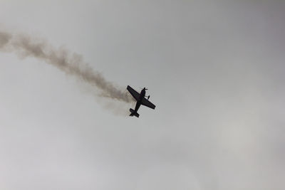 Low angle view of airshow in sky