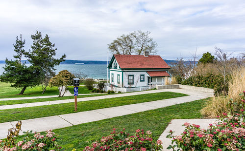 A walkway and building at brown's point lighthouse park in washington state.