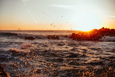 Scenic view of sea against sky during sunset