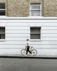 Urban cyclist walking the street