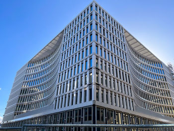 Low angle view of modern buildings against clear sky