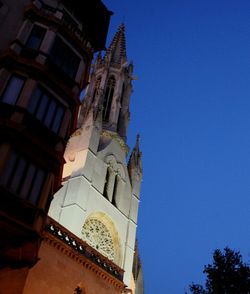 Low angle view of statue against clear blue sky