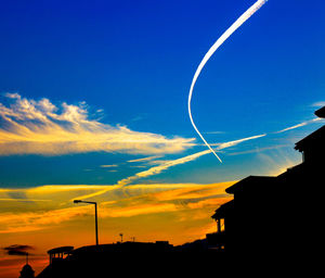 Low angle view of vapor trails in sky