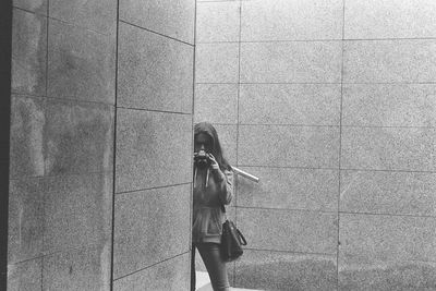 People standing on concrete wall