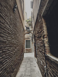 Rear view of man walking in tunnel