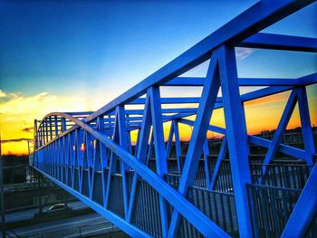 Low angle view of bridge against blue sky