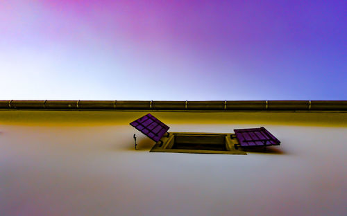 Low angle view of building window against sky