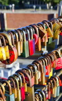 Close-up of padlocks on railing