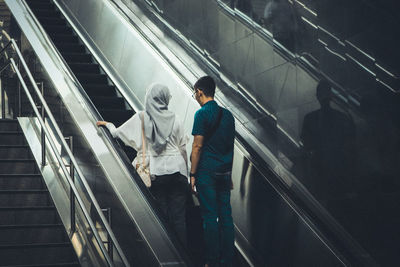 High angle view of people on escalator