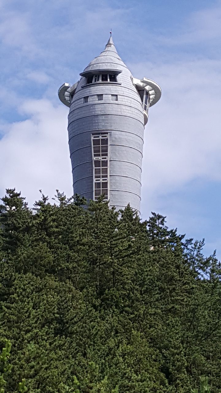 LOW ANGLE VIEW OF TOWER AND TREES AGAINST SKY