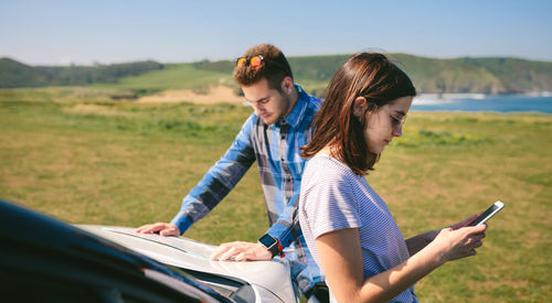 Young couple using mobile phone