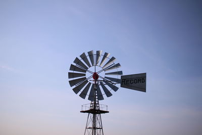 Low angle view of communications tower against sky