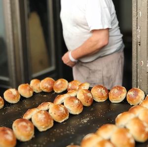 Midsection of man preparing food at store