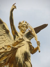 Low angle view of statue against sky