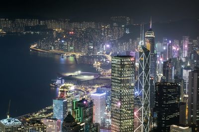 High angle view of illuminated buildings in city at night