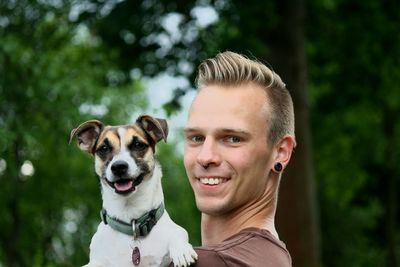 Portrait of man with dog