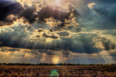 Scenic view of landscape against cloudy sky