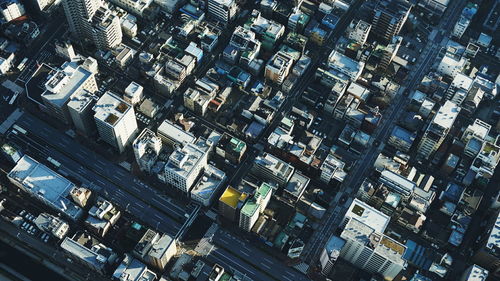 Aerial view of cityscape on sunny day