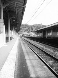 Railroad station against clear sky