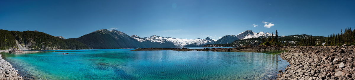 Panoramic view of mountains and turquoise coloured lake in garibaldi provincial park