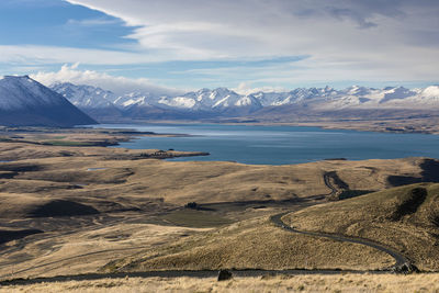 Scenic view of lake and mountains against sky