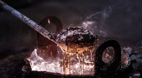 Close-up of ladle over cooking pot