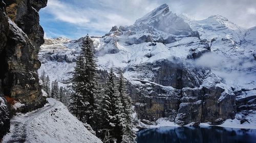 Scenic view of snowcapped mountains against sky