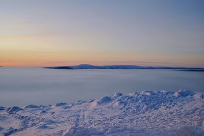 Scenic view of sea against sky during winter