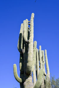 Low angle view of statue against clear blue sky