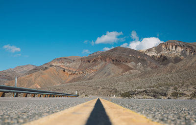 Scenic view of desert against blue sky