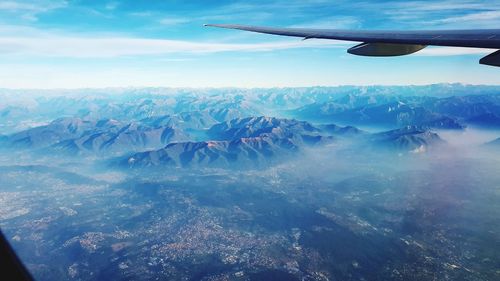 Aerial view of landscape and mountains against sky