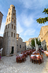 Chairs in front of historical building