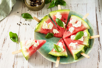 High angle view of fruits in plate on table