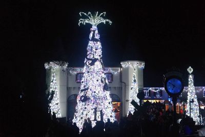 Low angle view of illuminated building at night