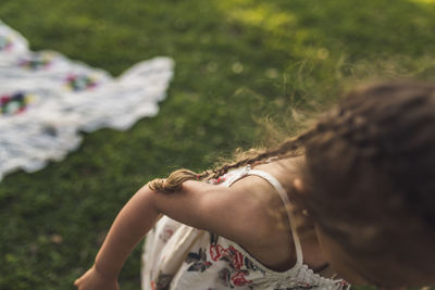 Close-up of girl playing on field at park