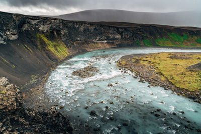 Scenic view of a river bed in a dramatic landscape in iceland